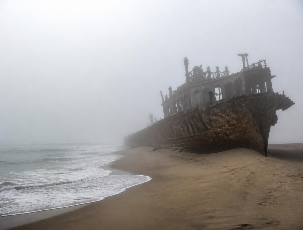 Skeleton Coast: fog, cold Atlantic surf, and rusting hulls.